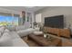 Bright living room with stylish furniture, and a view of the outdoors at 17632 Santorini Ct, Venice, FL 34293