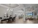 Spacious open-concept living space with eat in kitchen, dining area, and living room at 17632 Santorini Ct, Venice, FL 34293