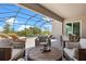 Comfortable screened patio with dining and lounging options at 17632 Santorini Ct, Venice, FL 34293