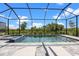 Beautiful backyard screened-in pool and patio area with inviting lounge chairs at 17632 Santorini Ct, Venice, FL 34293