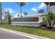 Wellen Park Golf & Country Club sign surrounded by manicured landscaping at 17632 Santorini Ct, Venice, FL 34293