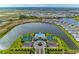 Aerial view of community amenities, including a pool, tennis courts, and picturesque landscaping near the lake at 17898 Cherished Loop, Bradenton, FL 34211