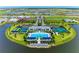 Aerial view of community with pool, tennis courts, clubhouse and surrounding homes at 17898 Cherished Loop, Bradenton, FL 34211