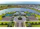 Beautiful aerial view showcasing community amenities, parking, and large lake at 17898 Cherished Loop, Bradenton, FL 34211