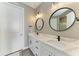 Bathroom features double vanities with marble countertops and modern fixtures at 17898 Cherished Loop, Bradenton, FL 34211