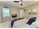 Comfortable bedroom featuring a ceiling fan, window, and stylish decor for a relaxing retreat at 17898 Cherished Loop, Bradenton, FL 34211