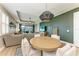View of the dining area with modern pendant lighting, open floor plan and access to the living room at 17898 Cherished Loop, Bradenton, FL 34211