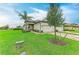 Beautiful home featuring a three-car garage, a brick driveway, and manicured lawn at 17898 Cherished Loop, Bradenton, FL 34211