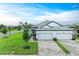 Attractive home with a three-car garage and well-maintained lawn at 17898 Cherished Loop, Bradenton, FL 34211