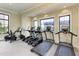 Well-lit gym with treadmills, elliptical machines, and stationary bikes for resident fitness at 17898 Cherished Loop, Bradenton, FL 34211