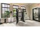Weight training machine with lake views through large windows in the resident gym at 17898 Cherished Loop, Bradenton, FL 34211