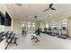 Spacious resident gym with free weights, weight machines, treadmills and lake views at 17898 Cherished Loop, Bradenton, FL 34211
