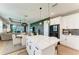 Contemporary kitchen seamlessly flowing into the living room and dining area at 17898 Cherished Loop, Bradenton, FL 34211