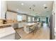 Open-concept kitchen with a large island, modern appliances, and seamless flow to the living area at 17898 Cherished Loop, Bradenton, FL 34211