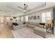 Inviting living room seamlessly connected to a modern kitchen, creating an ideal open concept living space at 17898 Cherished Loop, Bradenton, FL 34211