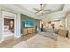 Cozy living area with a view into the kitchen and a relaxing bedroom space at 17898 Cherished Loop, Bradenton, FL 34211