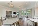 Elegant resident lounge with multiple seating areas, tables, and a kitchenette at 17898 Cherished Loop, Bradenton, FL 34211