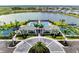 Stunning view of the pool, tennis courts, and clubhouse in a scenic community by the lake at 17898 Cherished Loop, Bradenton, FL 34211