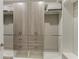 Bright walk-in closet featuring adjustable shelves, drawers, and hanging rods for optimal storage at 17898 Cherished Loop, Bradenton, FL 34211