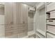 Walk-in closet with custom storage system, including shelves, drawers, and compartments for organization at 17898 Cherished Loop, Bradenton, FL 34211