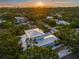 Stunning aerial view of neighborhood with lush trees, showcasing the beautiful property and vibrant surroundings at 1954 Goldenrod St, Sarasota, FL 34239