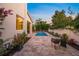 Serene backyard showcasing a private pool area, lush plants and pavers, ideal for outdoor enjoyment and relaxation at 1954 Goldenrod St, Sarasota, FL 34239