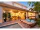 Relaxing backyard with a lounge chair and seamless access to the patio at 1954 Goldenrod St, Sarasota, FL 34239