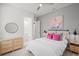 Inviting bedroom with soft decor, a dresser, and comfortable bed at 1954 Goldenrod St, Sarasota, FL 34239