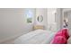 Cozy bedroom with a light-colored palette and natural light at 1954 Goldenrod St, Sarasota, FL 34239