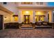 Inviting front porch with seating area, stylish planters and modern lighting at 1954 Goldenrod St, Sarasota, FL 34239