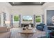 Inviting living room with a cozy feel, large windows, and hardwood floors at 1954 Goldenrod St, Sarasota, FL 34239