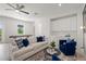 Relax in this sunlit living room with a comfortable sofa, modern furnishings, and entertainment area at 1954 Goldenrod St, Sarasota, FL 34239