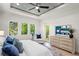 Light-filled main bedroom with tray ceiling, large windows, and backyard views at 1954 Goldenrod St, Sarasota, FL 34239