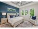 A spacious main bedroom featuring many windows for natural light and a seating area at 1954 Goldenrod St, Sarasota, FL 34239