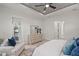 Bright main bedroom with neutral color scheme, tray ceiling, and backyard views at 1954 Goldenrod St, Sarasota, FL 34239