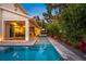 Stunning pool with lush landscaping and easy access to the outdoor living area at 1954 Goldenrod St, Sarasota, FL 34239