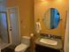 Bathroom with textured walls, granite topped vanity, tile floors, and glass shower at 20170 Tralee Dr, Port Charlotte, FL 33952
