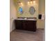 Bathroom showcasing a double vanity with granite countertops and modern fixtures at 20170 Tralee Dr, Port Charlotte, FL 33952