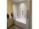Bathroom showcasing a tiled shower and safety bars for support at 20170 Tralee Dr, Port Charlotte, FL 33952