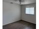 Simple bedroom with tile flooring, baseboard trim and a single window at 20170 Tralee Dr, Port Charlotte, FL 33952