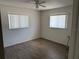 Bedroom with tile flooring, baseboard trim and windows with blinds at 20170 Tralee Dr, Port Charlotte, FL 33952
