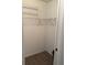 Walk-in closet featuring wire shelving, wooden floors, and white walls at 20170 Tralee Dr, Port Charlotte, FL 33952