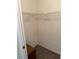 Walk-in closet with wire shelving, wooden floors and white walls at 20170 Tralee Dr, Port Charlotte, FL 33952