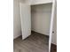Bedroom closet with white walls, new wood flooring, and wire shelving at 20170 Tralee Dr, Port Charlotte, FL 33952