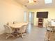Bright open space featuring a dining area with table and chairs, flowing into the kitchen at 20170 Tralee Dr, Port Charlotte, FL 33952