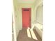 Inviting front entrance with a bright red door and tiled entryway, ready to welcome guests at 20170 Tralee Dr, Port Charlotte, FL 33952