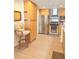 Well-lit kitchen features stainless steel appliances, wood cabinets and modern tile flooring at 20170 Tralee Dr, Port Charlotte, FL 33952