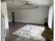 Bright living room featuring hardwood floors, neutral paint, and a large window offering natural light at 20170 Tralee Dr, Port Charlotte, FL 33952
