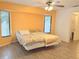 Bright main bedroom featuring large windows, and tile floors at 20170 Tralee Dr, Port Charlotte, FL 33952