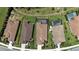 Aerial view showcases the property's layout, landscaping, and proximity to neighboring homes at 208 Ariano Ave, Nokomis, FL 34275